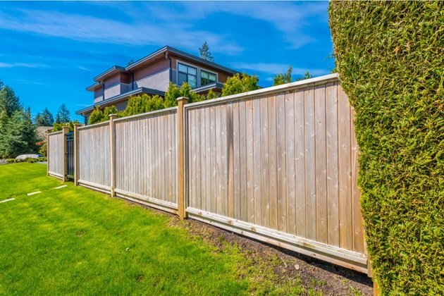 Expert team installing a timber fence in Coomera